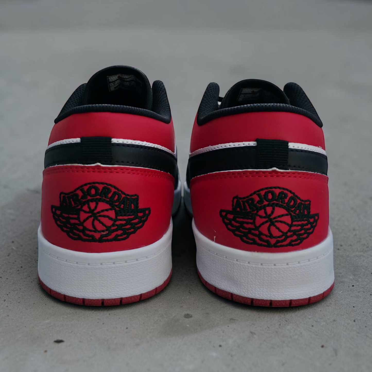 Jordan 1 Low Black Red